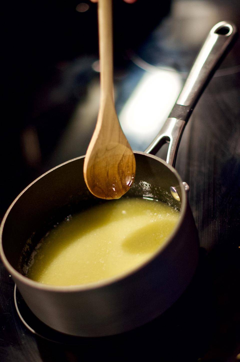 Butter warming in a pot in order to separate solids/make clarified butter