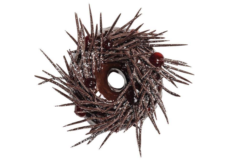 An upscale chocolate wreath donut made with Mona Lisa decor