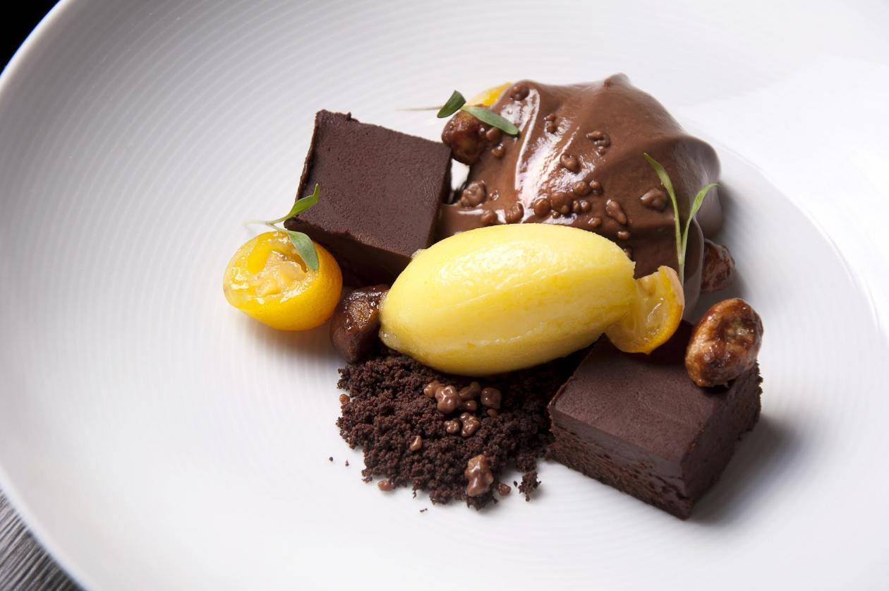 Chocolate marquise with poached kumquats and salted caramelised macadamias