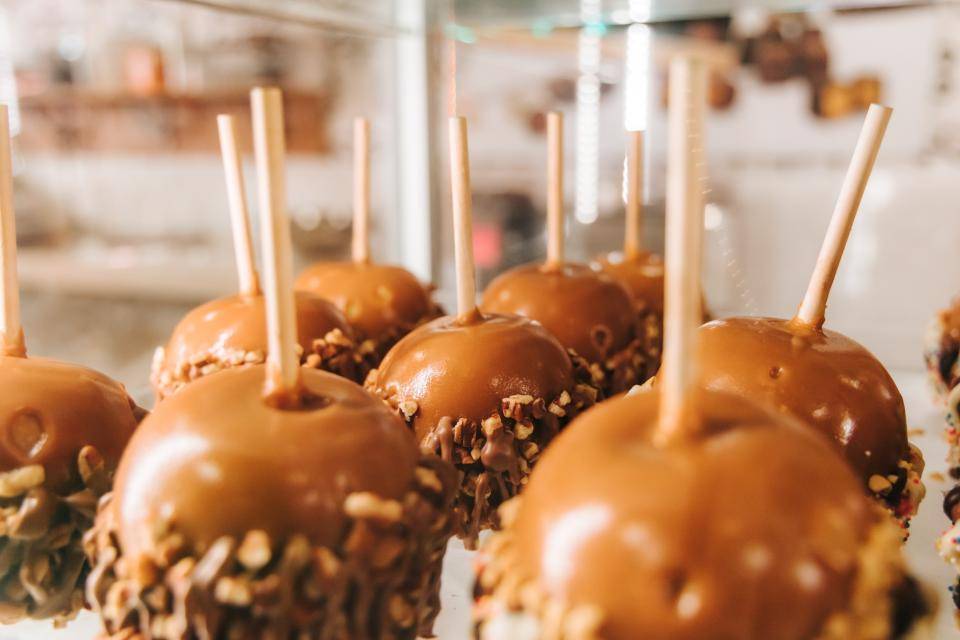 caramel-covered apples dipped in nuts