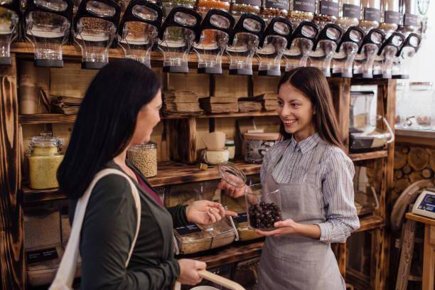 Two women in candy/chocolate shop