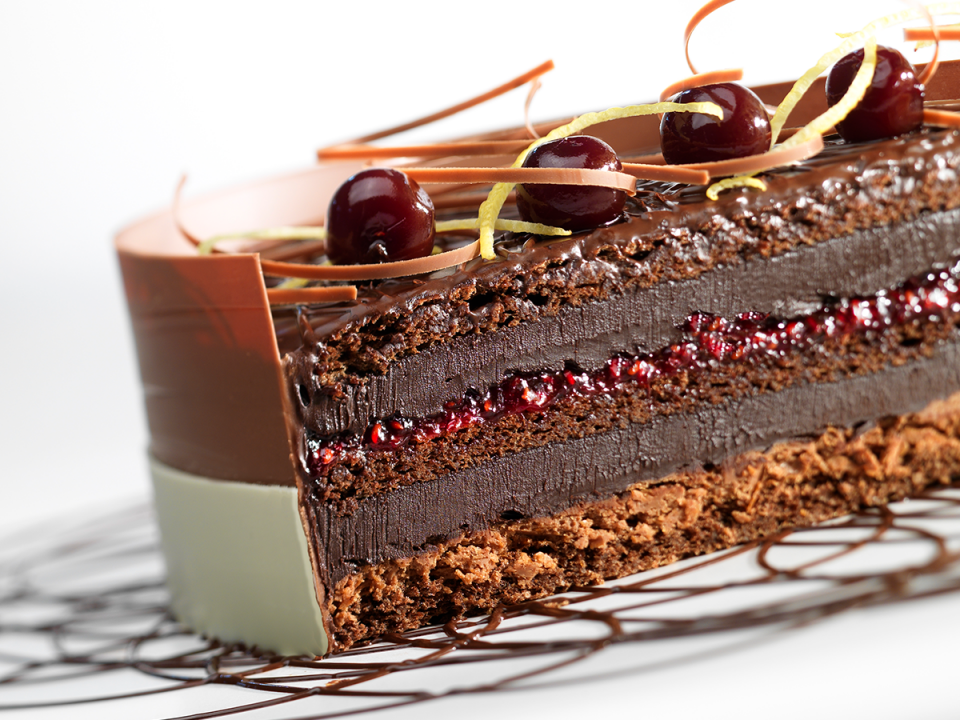 An upscale, entremet-style Black Forest Cake with several layers and textures