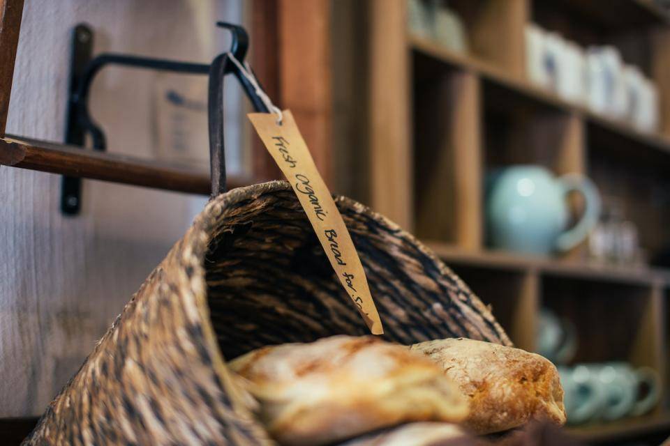 A rustic basket containing loaves of bread