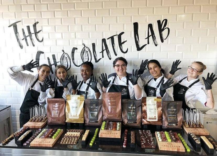 Chef Minette poses with students from a Chocolate Academy™ course