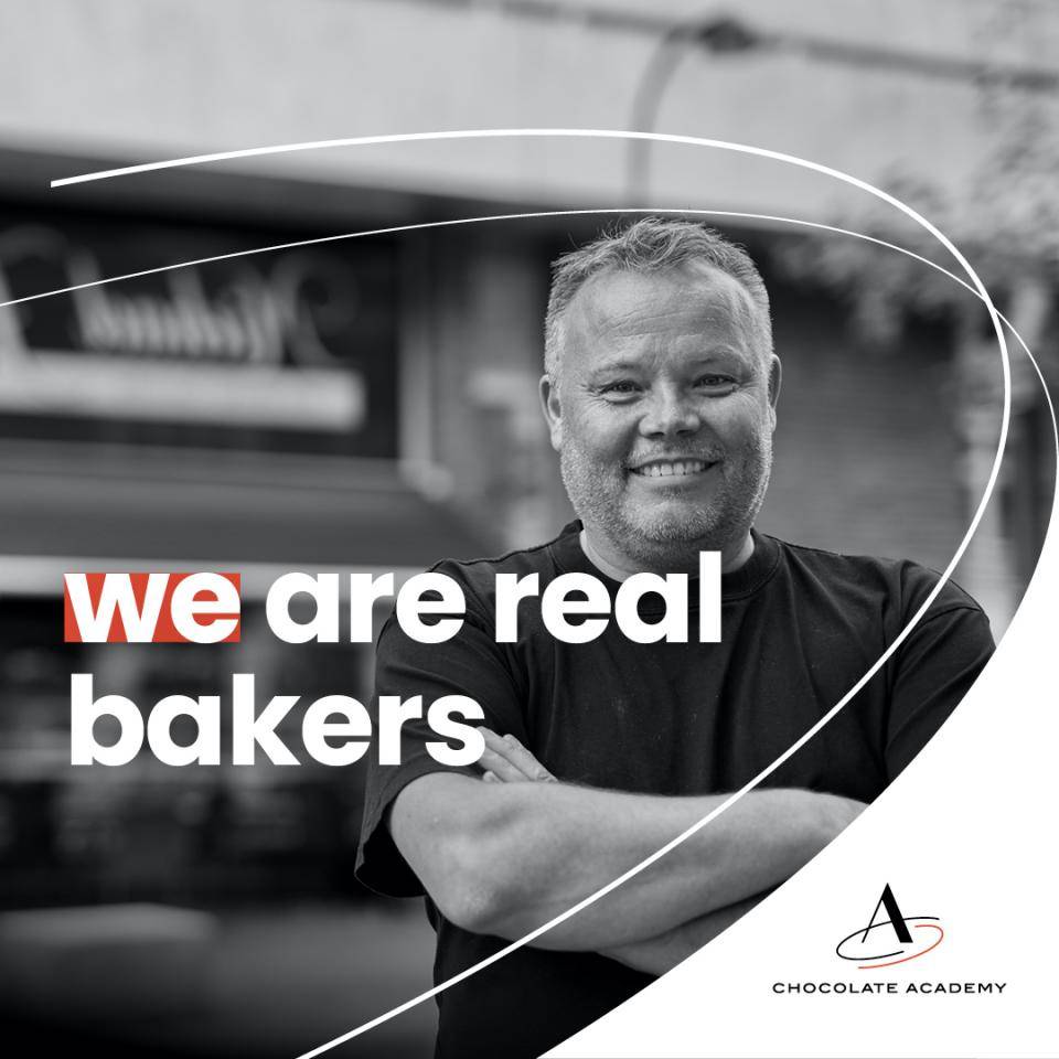 Baker and business owner Michael Hjort poses outside his shop in Denmark