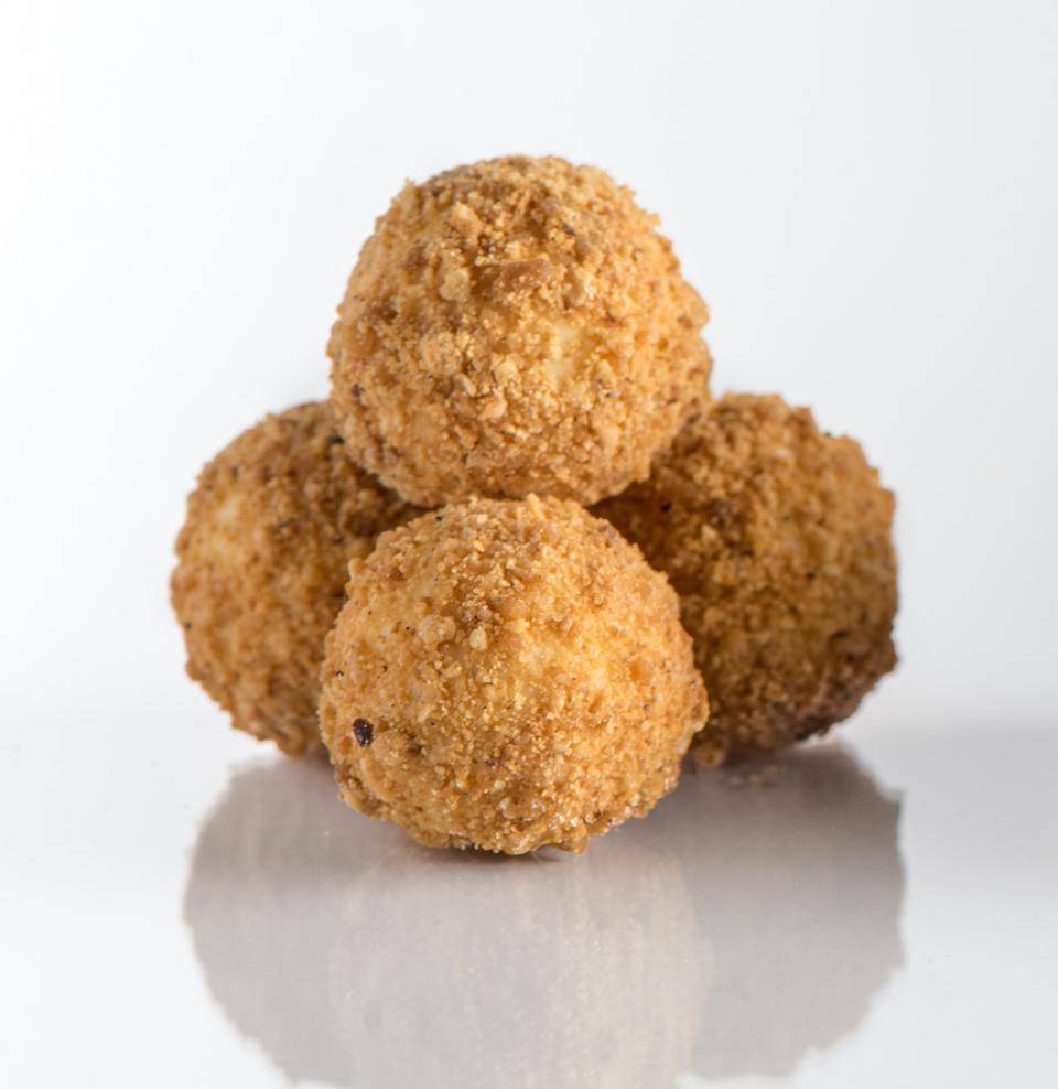 Goat cheese truffles coated in Cacao Barry Praline Grains