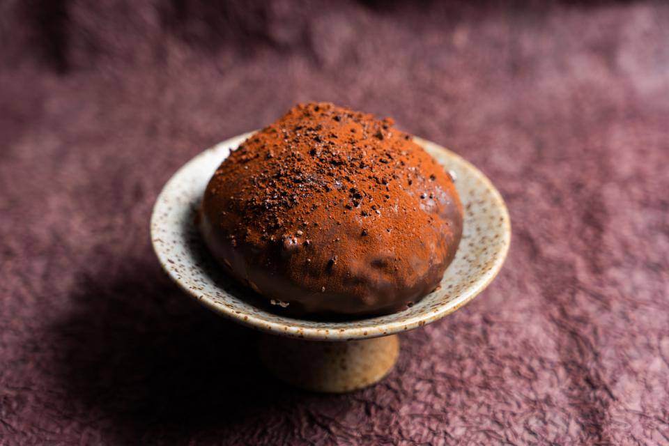 A cocoa-powder-dusted chocolate bun aka "Dirty Bread" or Zang zang bao