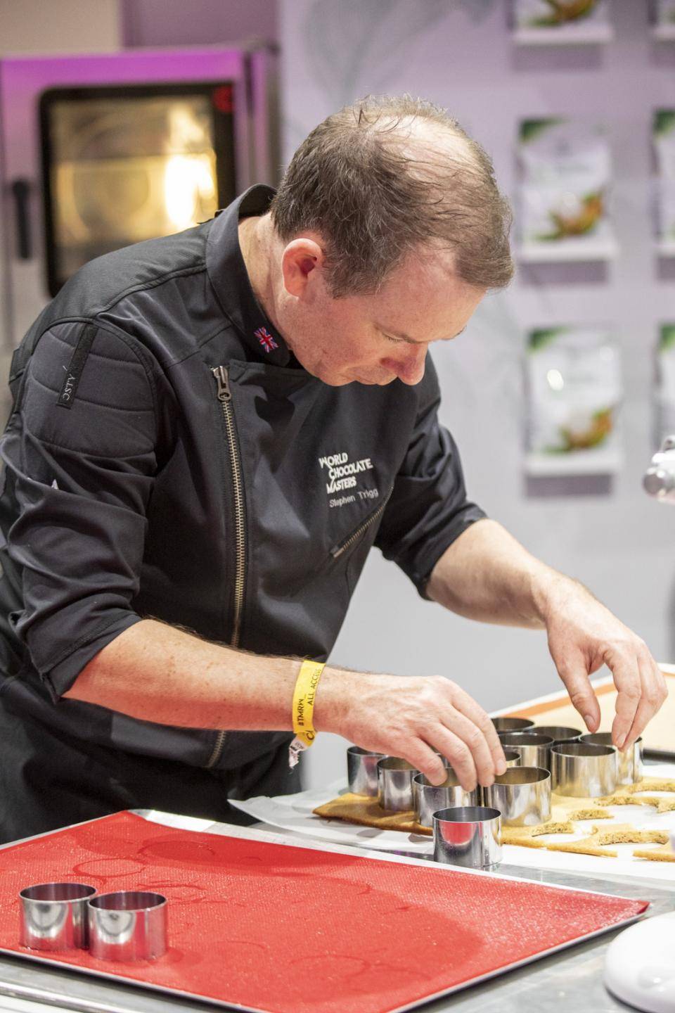 Chef Stephen Trigg building a dessert at the World Chocolate Masters Final Competition