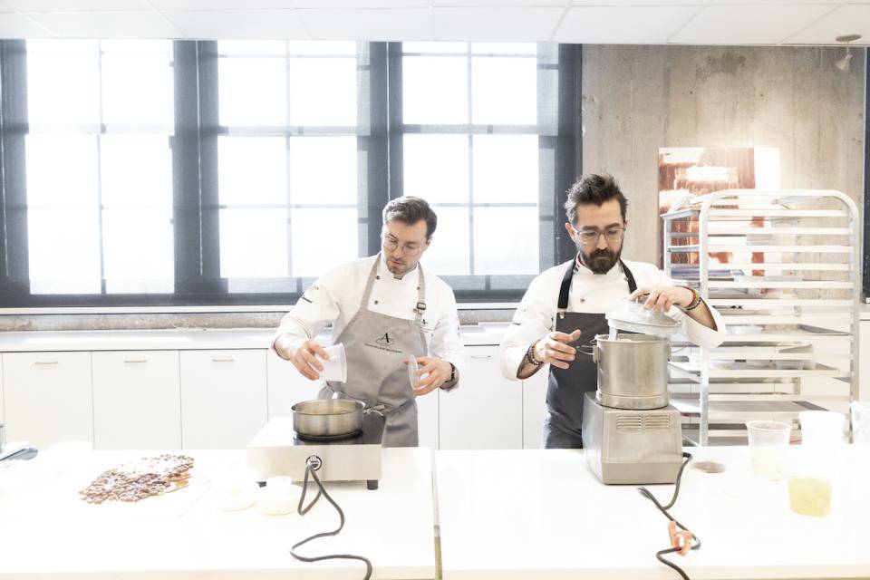 Chefs Nicoll Notter and Dimitri Fayard at work in the new kitchen at Chocolate Academy™ NYC