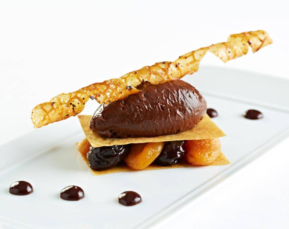 Spiced Chocolate Mousse, Apricot, Prunes & Poppy Crisp. Photo: Courtesy of Le Gavroche