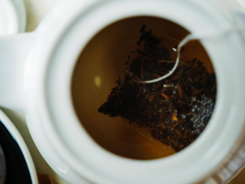 close-up looking down into a pot of tea brewing