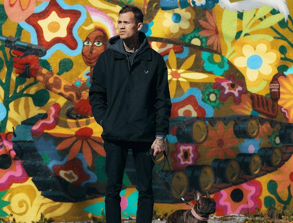 Chef Sebastian Pettersson in front of a bright, graffitied wall