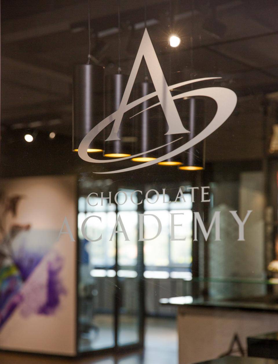The entrance of CA South Africa, with the Chocolate Academy logo etched on the glass