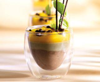 A layered mango dessert in a glass