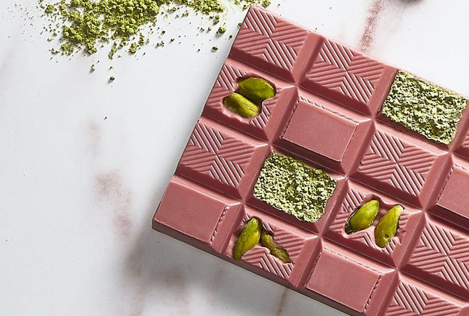 A ruby chocolate tablet with pistachios