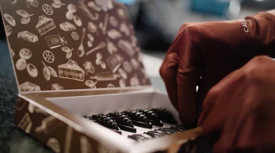 A chef stores a chocolate product in a special box