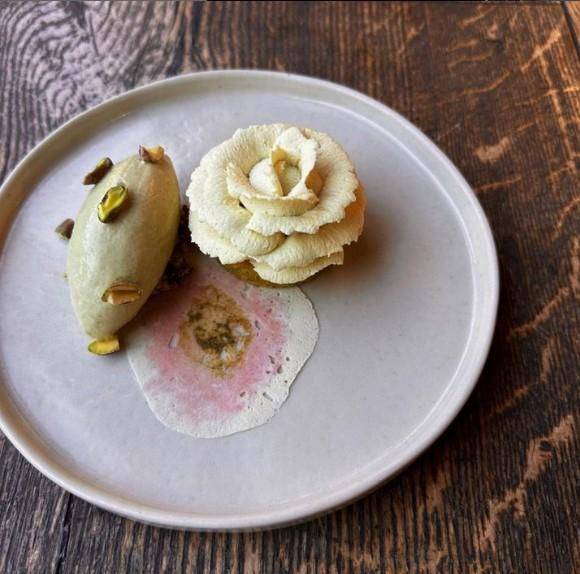 A plated dessert featuring pistachio