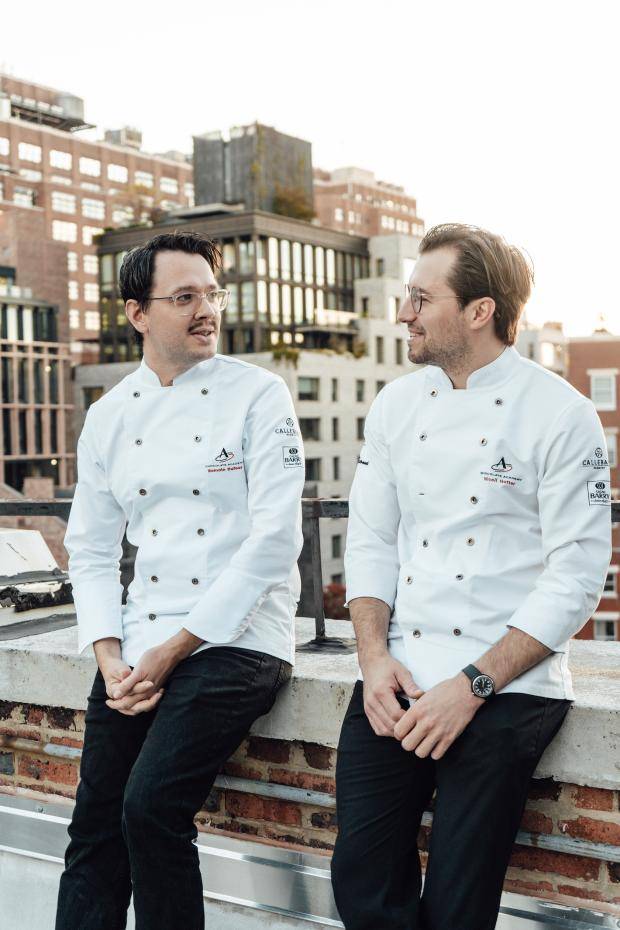 Chefs Romain Dufour and Nicoll Notter chat on the rooftop
