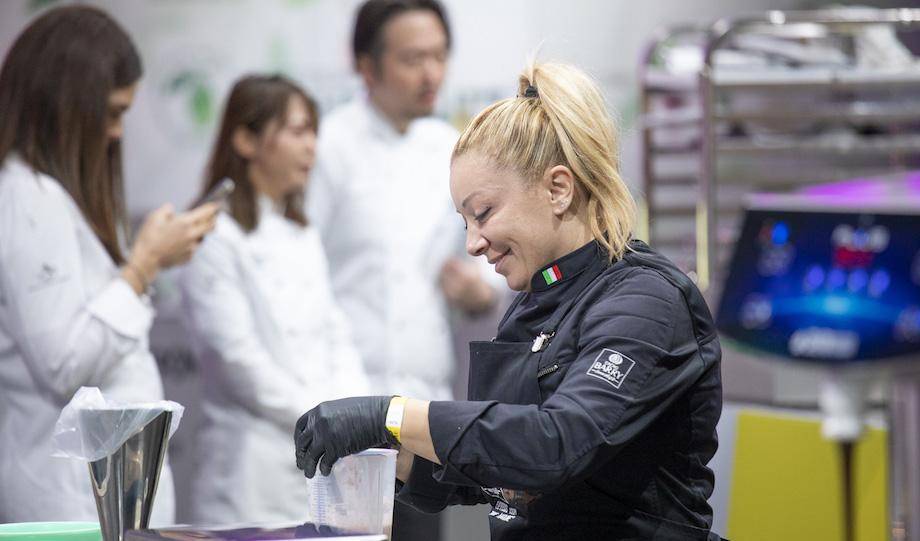 Ann Gerasi smiles while she works