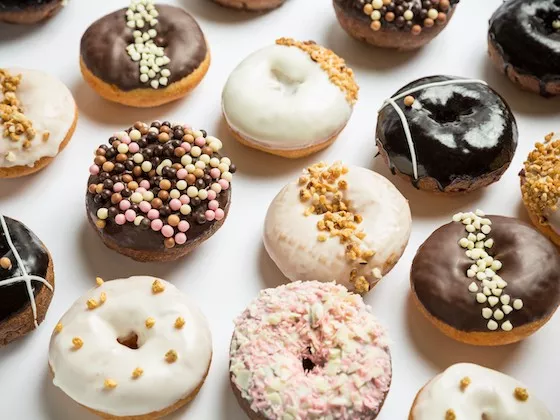 An assortment of donuts with a variety of garnishes