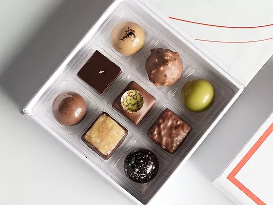 close-up of a box showing 6 different chocolate truffles