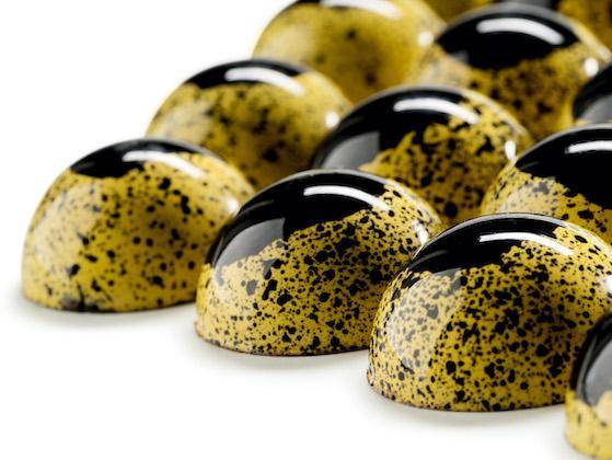 Shiny yellow and black bonbons - honey + Cacao Barry Zephyr white couverture