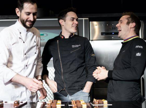 Chefs Alistair Birt, Elias Läderach, and Lluc Crusellas work together in the kitchen