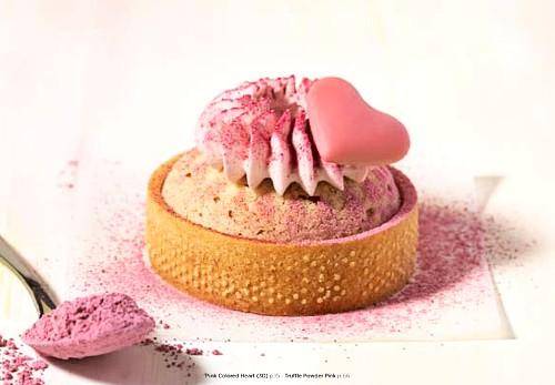 A colorful Choux tart with Pink powder and chocolate heart garnish